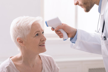 Fevers measure forehead by infrared for patient in clinic