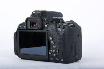 DSLR camera isolated on a white background.