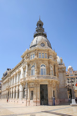 Fototapeta na wymiar Palacio Consistorial, or Casa Consistorial building which houses the Town Hall of Cartagena. The modernist building which was completed in 1907 by architect Tomas Rico, Cartagena, Murcia, Spain.