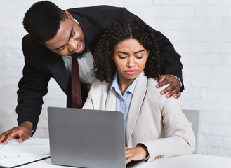 African American employee being victim of sexual harassment at worlplace