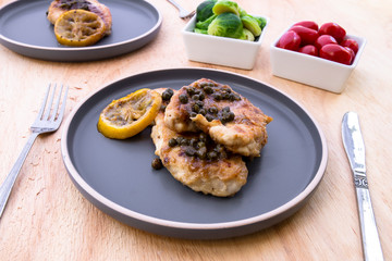 Italian food Lemon chicken Piccata  with Brussels Sprouts