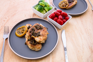 Italian food Lemon chicken Piccata  with Brussels Sprouts