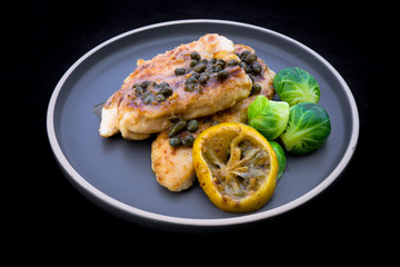 Italian food Lemon chicken Piccata  with Brussels Sprouts