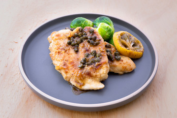 Italian food Lemon chicken Piccata  with Brussels Sprouts