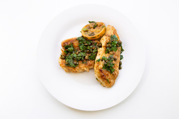 Italian food Lemon chicken Piccata with parsley