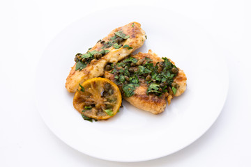 Italian food Lemon chicken Piccata with parsley