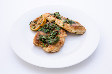 Italian food Lemon chicken Piccata with parsley