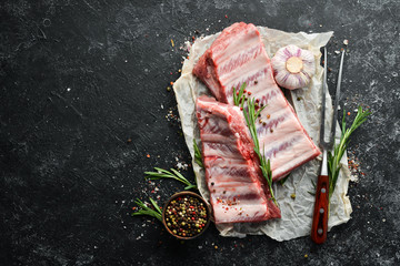 Raw pork ribs with spices. Meat. Top view. Free space for your text.