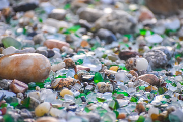 Shells, stones and crystals rounded by the erosion of the sea Los Cristales Beach, Galicia. Spain.