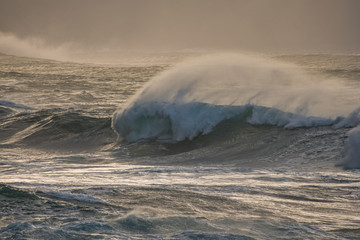 Detail of big waves in rough sea at sunset. Galicia Spain.