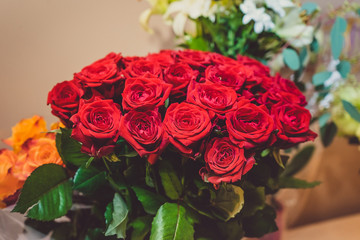 gorgeous and lush bouquet of red roses in a room