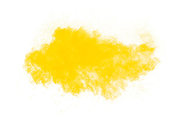 Yellow dust particles explosion on white background.Yellow powder dust splash.