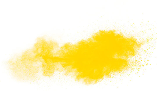 Yellow dust particles explosion on white background.Yellow powder dust splash.