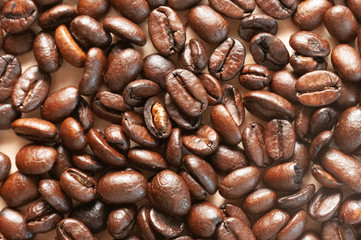Coffee beans Coffee scattered on the table, roasted top view, natural sunlight falling on coffee, close up, background.