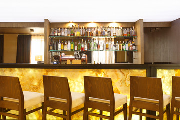 Futuristic marble yellow bar counter with chairs