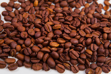 roasted coffee beans on a white background