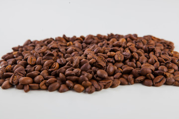 roasted coffee beans on a white background