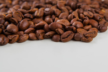 roasted coffee beans on a white background