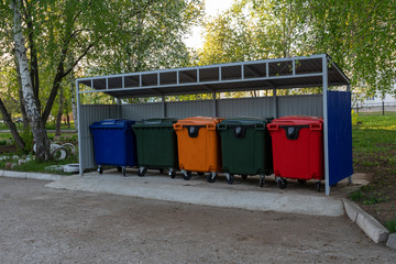 Different color plastic street containers for garbage collection