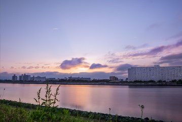 Fototapeta premium Panoramic sunset view of Kyuedogawa River in Maihama, Urayasu.