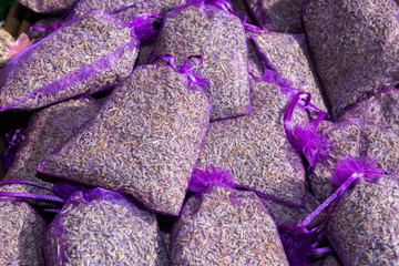 Pouch with lavender in a wooden basket. Fragrant bag of lavender flowers.