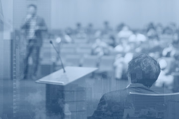 Young businessman at business conference room with public giving presentations. Audience at the...