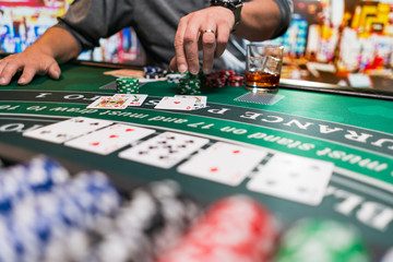 Man playing BlackJack at the casino