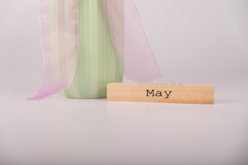 vase next to the month of may