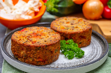 Tasty vegetarian food, burgers with Greek feta cheese, sweet red paprika, green olives and zucchini