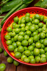 New harvest of ripe green peas legumes