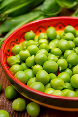 New harvest of ripe green peas legumes