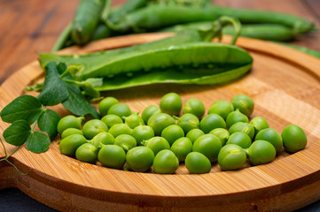 New harvest of ripe green peas legumes