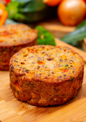 Tasty vegetarian food, burgers with Greek feta cheese, sweet red paprika, green olives and zucchini