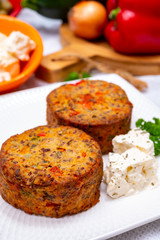 Tasty vegetarian food, burgers with Greek feta cheese, sweet red paprika, green olives and zucchini