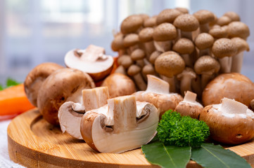 Fresh ingredients for tasty vegetarian mushrooms soup, brown champignons, buna shimeji, carrots