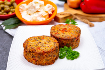 Tasty vegetarian food, burgers with Greek feta cheese, sweet red paprika, green olives and zucchini