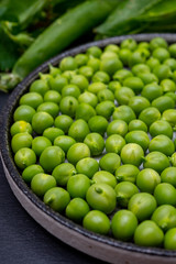 New harvest of ripe green peas legumes