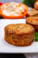 Tasty vegetarian food, burgers with Greek feta cheese, sweet red paprika, green olives and zucchini