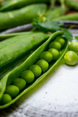 New harvest of ripe green peas legumes