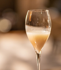 a glass of white drink 