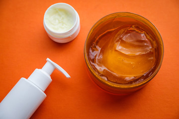Beauty care products on orange background