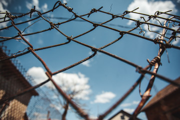 barbed wire against sky