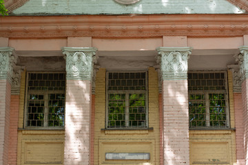 vintage brick building with windows a big columns
