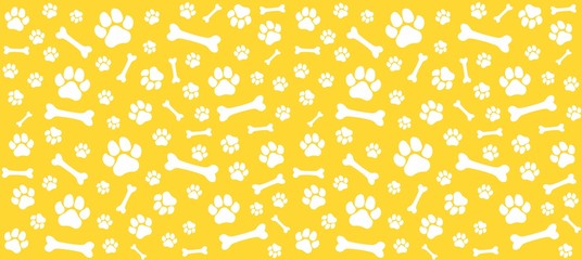 Seamless endless pattern of traces of dog paws. Dog legs and bones. Monochrome yellow print