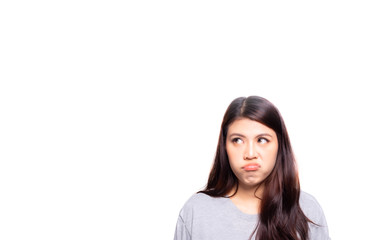 Young asian woman get bored, upset, look at copy space, isolated on white background. Pretty girl gesturing on face like a bad mood, unhappy, touchy, bored something. She look upward, feel annoyed