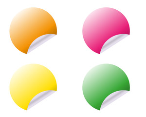 Circular adhesive labels of different colours on white background. Vector illustration.