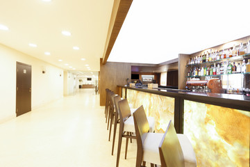 Bar counter and chairs in modern hotel