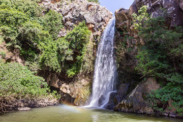 Mountain  Saar Falls with cold and crystal clear water descends from a crevice in the mountains of...