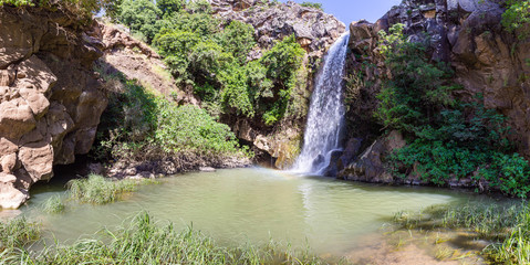 Mountain  Saar Falls with cold and crystal clear water descends from a crevice in the mountains of...