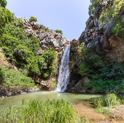 Mountain  Saar Falls with cold and crystal clear water descends from a crevice in the mountains of...